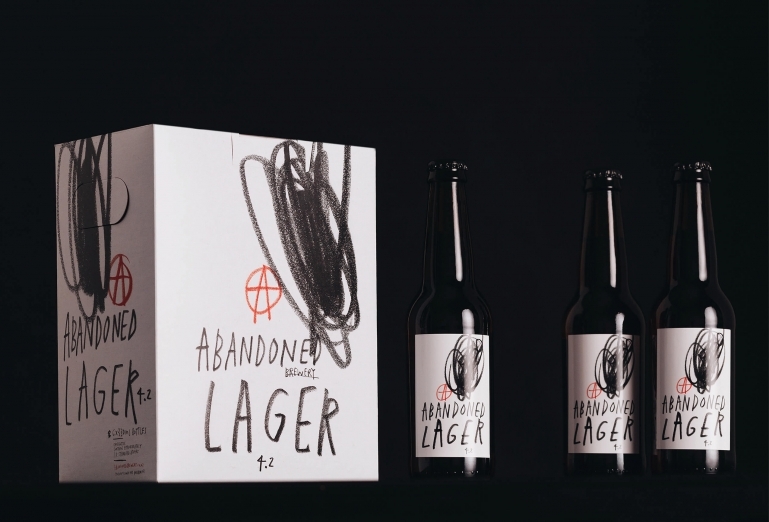 A collection of beer bottles and packaging for Abandoned Brewery designed by Chrometoaster.