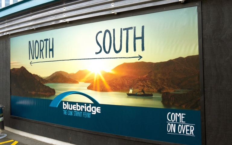 A billboard featuring the North-South marketing message