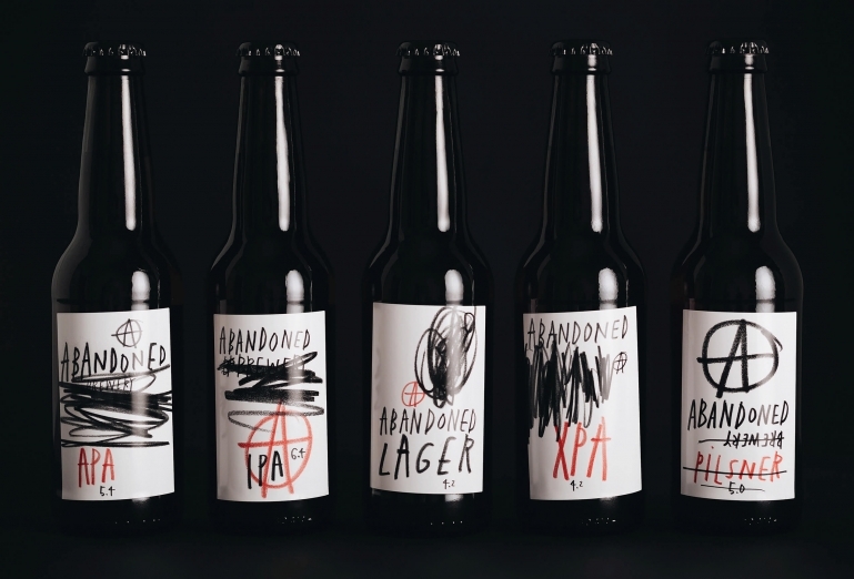 A collection of beer bottles from Abandoned Brewery with branding designed by Chrometoaster.