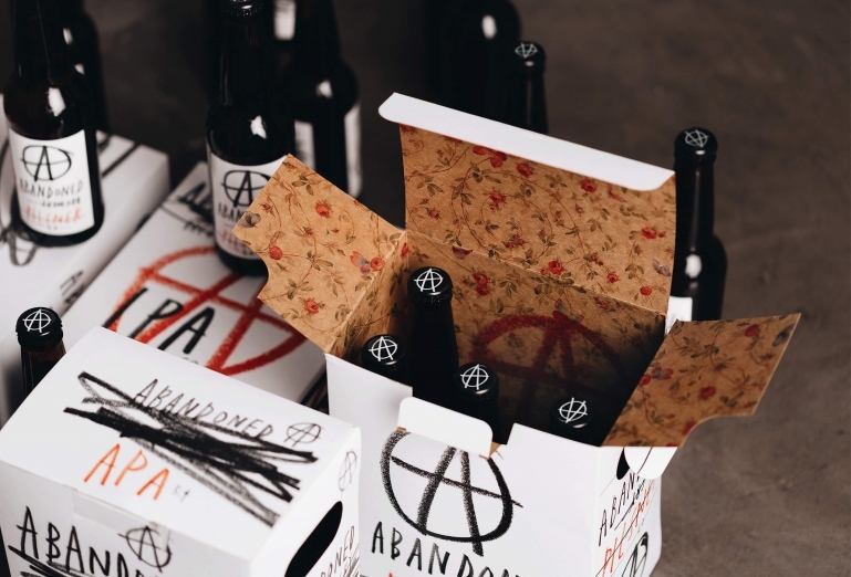 A collection of beer bottles and packaging from Abandoned Brewery designed by Chrometoaster.