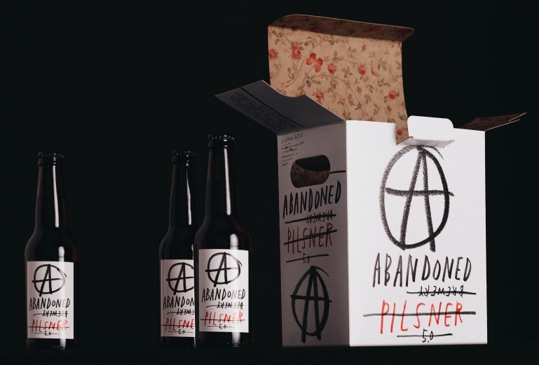 A collection of bottles and packaging for Abandoned Brewery designed by Chrometoaster.
