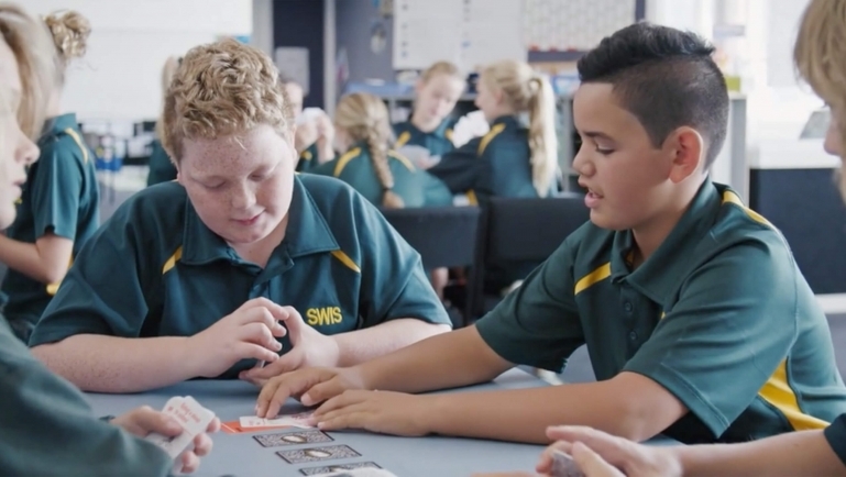 Kids playing Game of Awesome in a classroom